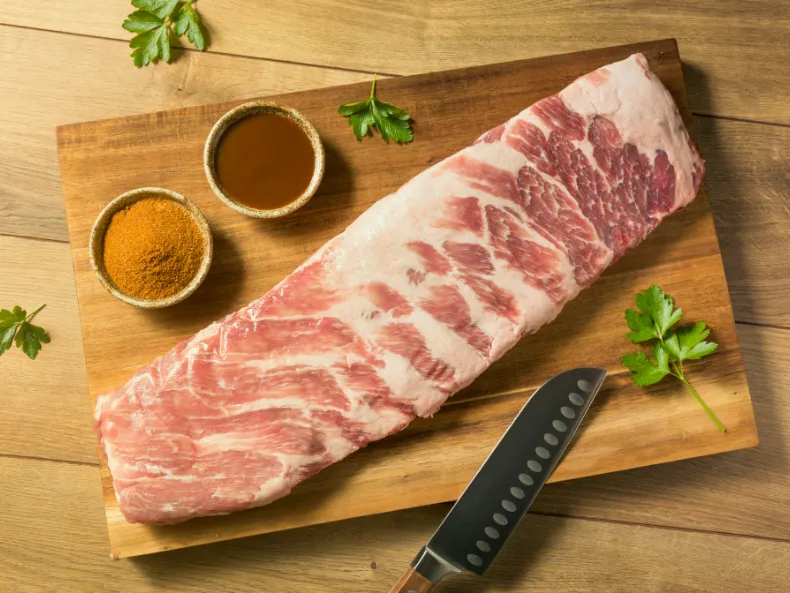Fresh-cut pork ribs representing St. Louis' culinary culture.